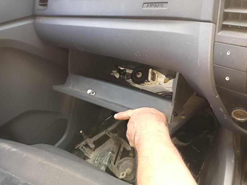 A Person is Opening the Glove Box of a Car — South West 4WD Wreckers In Brisbane, QLD