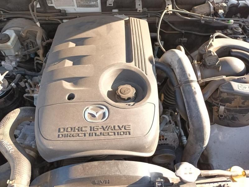 A Close Up of a Car Engine That Says Dohc 16 Valve Direct Injection — South West 4WD Wreckers In Harristown, QLD