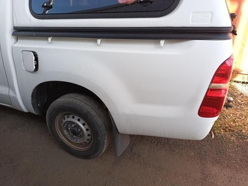 A White Truck With a Canopy is Parked on the Side of the Road — South West 4WD Wreckers In Harristown, QLD