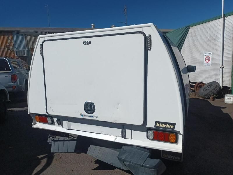 A White Canopy is Sitting on the Back of a Truck — South West 4WD Wreckers In Harristown, QLD