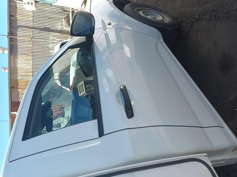 A White Truck is Parked on the Side of the Road — South West 4WD Wreckers In Harristown, QLD