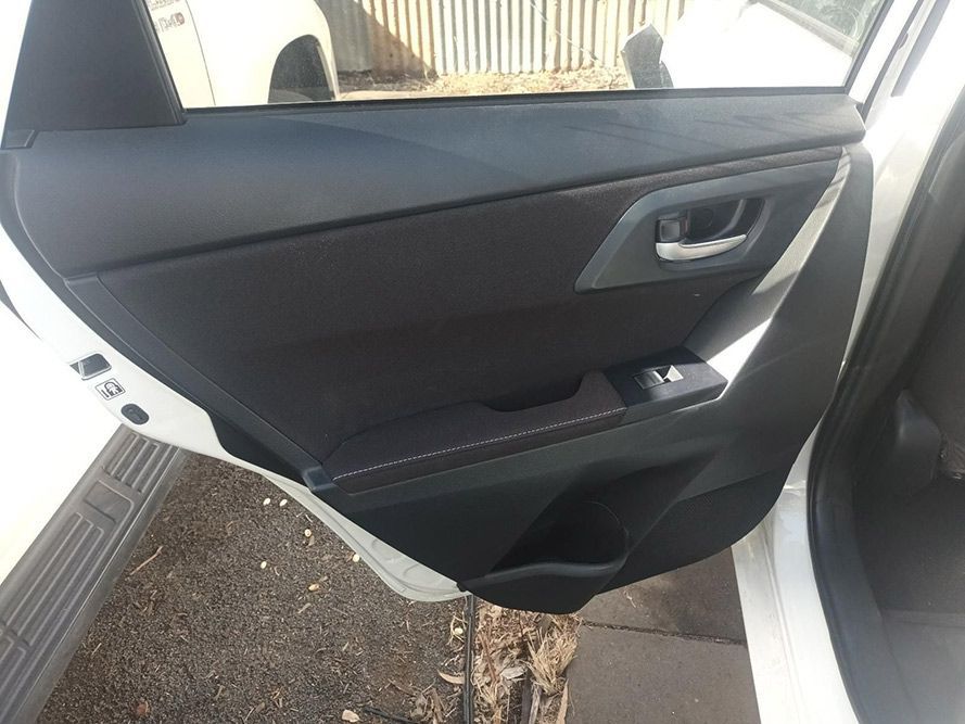 The Back Door of a White Car with the Door Open — South West 4WD Wreckers in Harristown, QLD