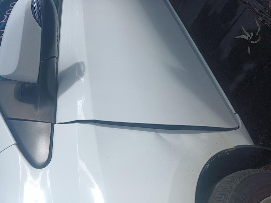 A Close Up of a White Car with a Damaged Fender — South West 4WD Wreckers in Harristown, QLD