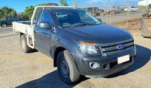 A Black Truck With a White Bed is Parked on the Side of the Road — South West 4WD Wreckers In Brisbane, QLD