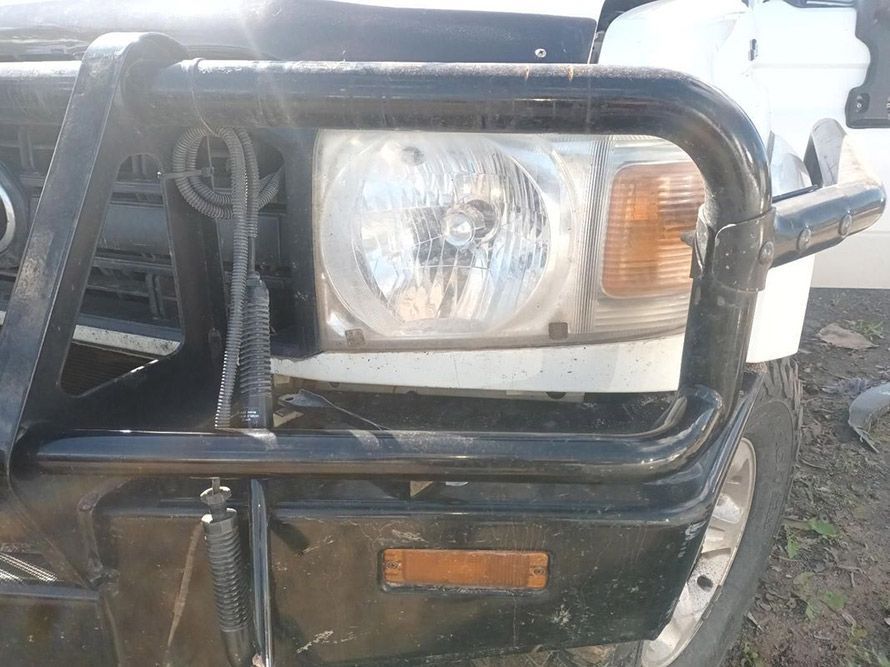 A Close Up of a Car's Headlight and Bumper — South West 4WD Wreckers in Harristown, QLD