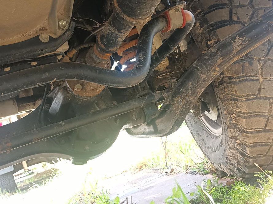 A Close Up of the Underside of a Truck with a Tire — South West 4WD Wreckers in Harristown, QLD