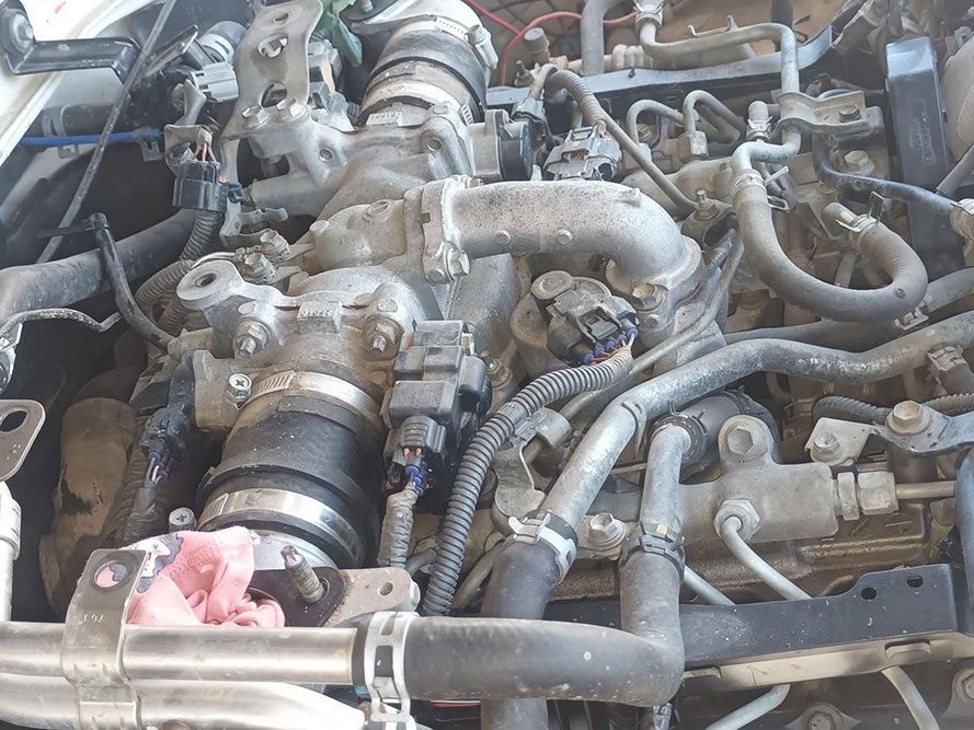 A Close Up of a Car Engine with a Lot of Wires and Pipes — South West 4WD Wreckers in Harristown, QLD