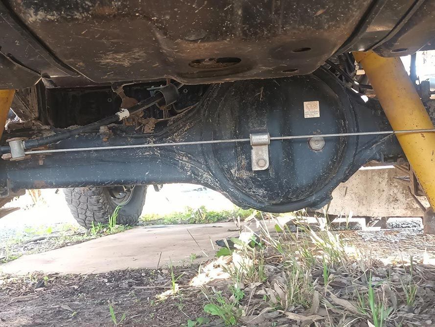 The Underside of a Truck with a Yellow Shock Absorber — South West 4WD Wreckers in Harristown, QLD