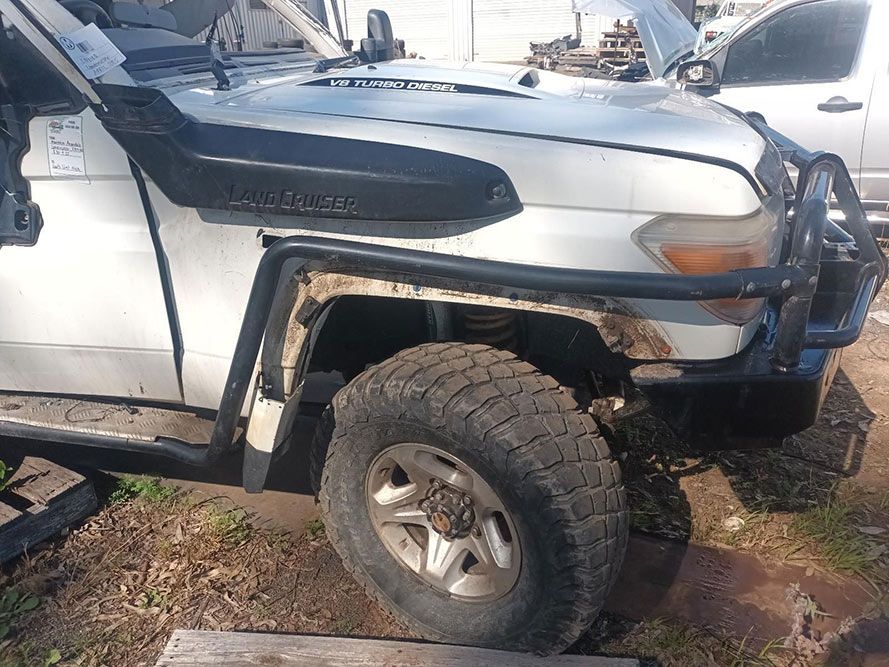 A Toyota Land Cruiser is Parked on the Side of the Road — South West 4WD Wreckers in Harristown, QLD