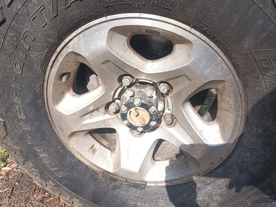 A Close Up of a Tire with a Hubcap on It — South West 4WD Wreckers in Harristown, QLD