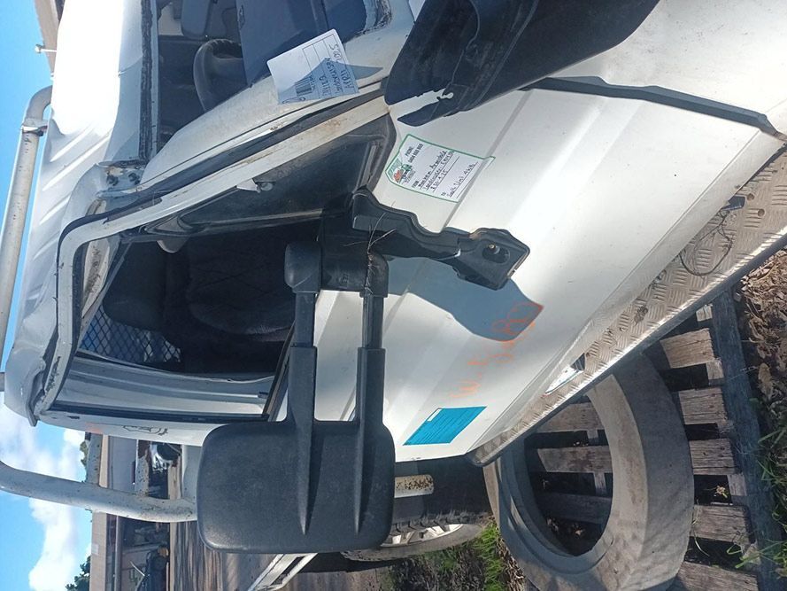 A White Truck with the Door Open and a Mirror on the Side — South West 4WD Wreckers in Harristown, QLD