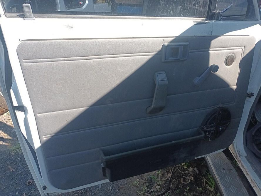 A White Car with the Door Open and a Speaker in the Door — South West 4WD Wreckers in Harristown, QLD