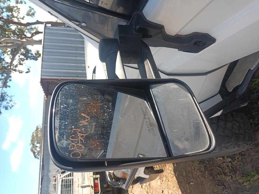 A Close Up of a Side View Mirror on a White Truck — South West 4WD Wreckers in Harristown, QLD