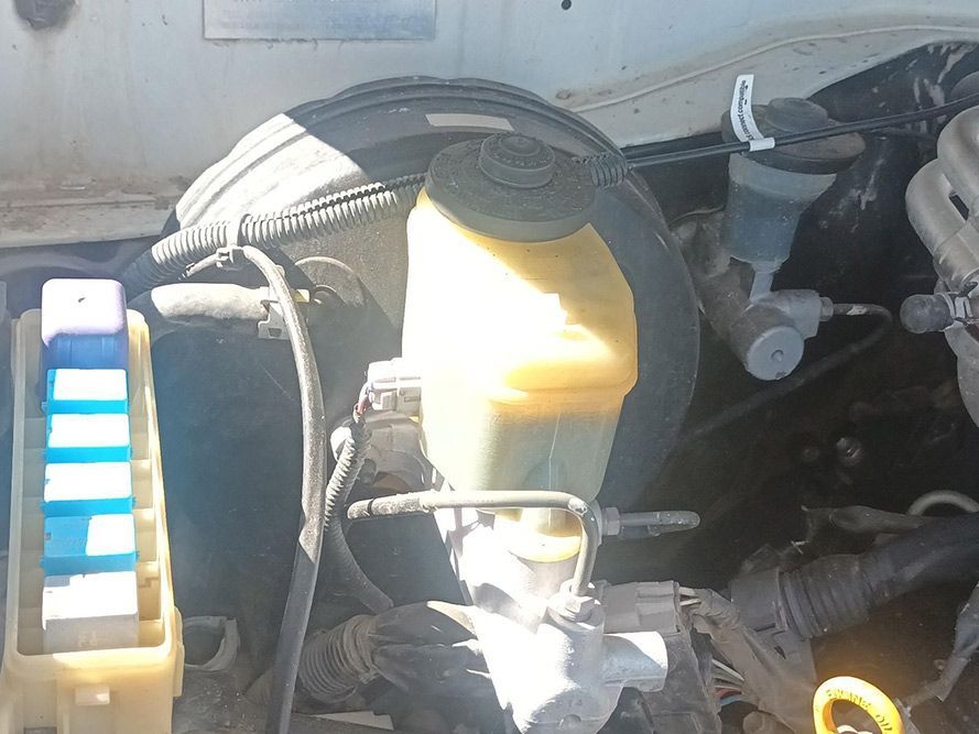 A Close Up of a Car Engine with a Yellow Liquid in It — South West 4WD Wreckers in Harristown, QLD