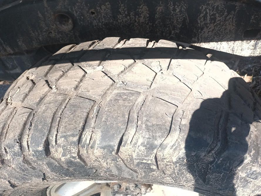 A Close Up of a Dirty Tire on a Car — South West 4WD Wreckers in Harristown, QLD