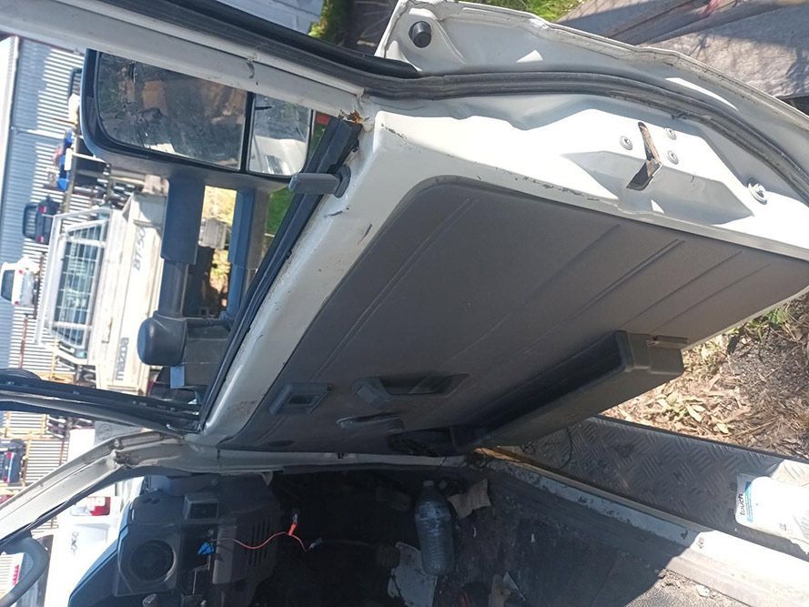The Inside of a White Car with the Door Open — South West 4WD Wreckers in Harristown, QLD