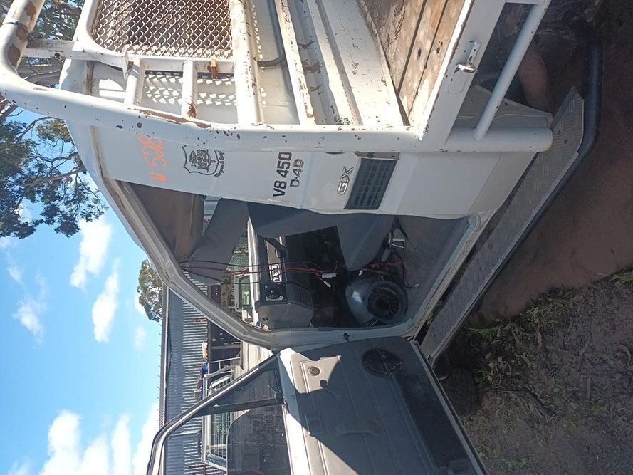 A Car with the Door Open and a Sticker on the Side — South West 4WD Wreckers in Harristown, QLD