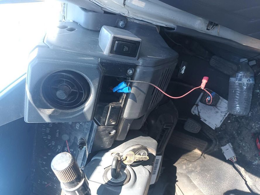A Close Up of a Car Dashboard with a Red Wire Coming Out of It — South West 4WD Wreckers in Harristown, QLD