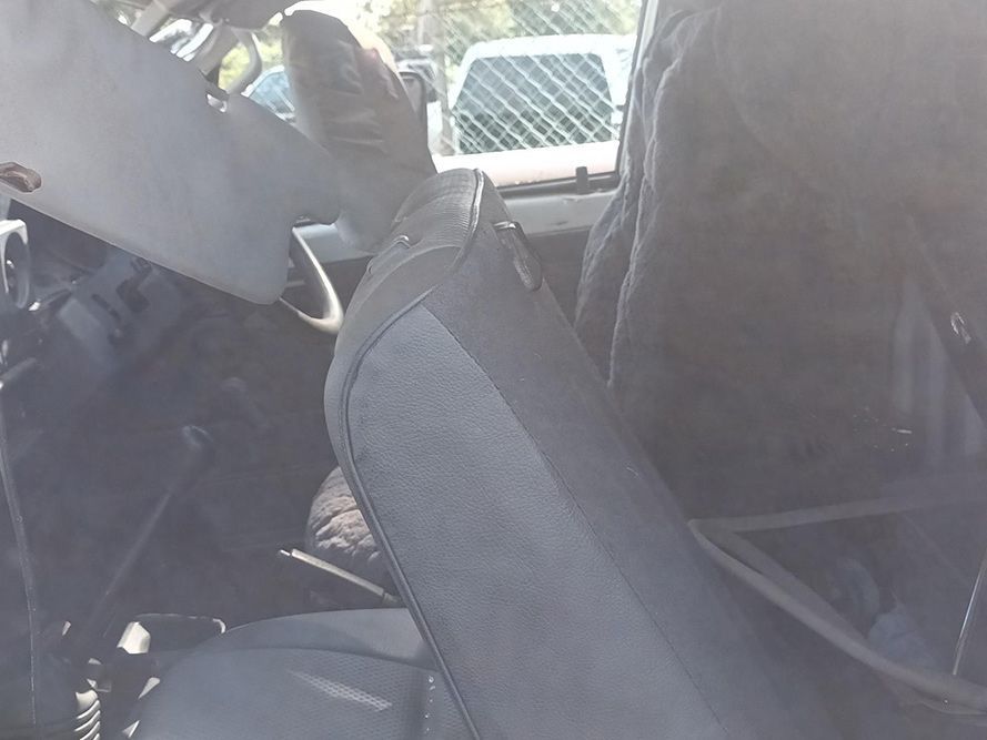 A Person is Sitting in the Driver's Seat of a Car — South West 4WD Wreckers in Harristown, QLD