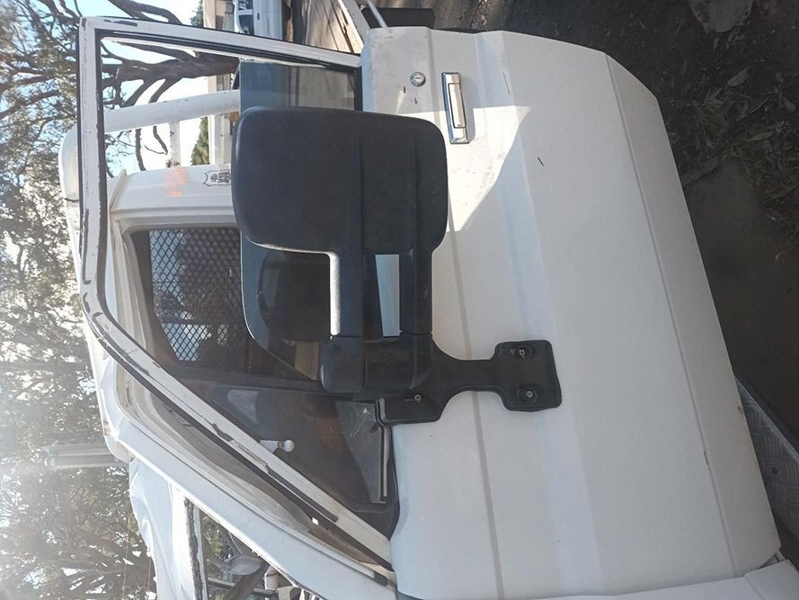 A White Car with a Black Mirror on the Side of It — South West 4WD Wreckers in Harristown, QLD