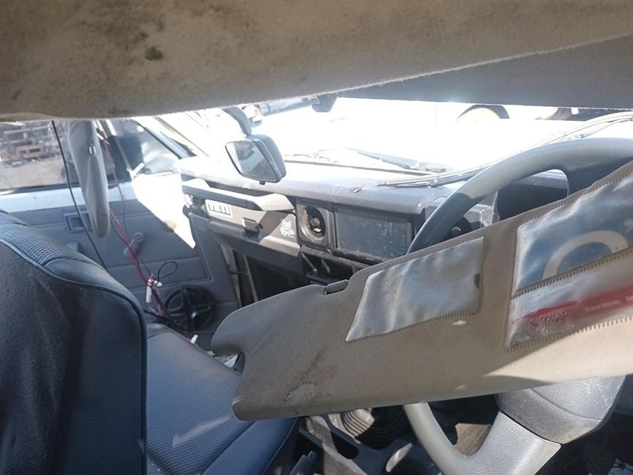 The Inside of a Car with a Broken Steering Wheel and Dashboard — South West 4WD Wreckers in Harristown, QLD
