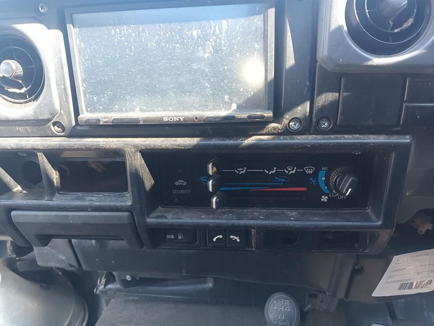 A Close Up of the Dashboard of a Car with a Radio and a Climate Control — South West 4WD Wreckers in Harristown, QLD