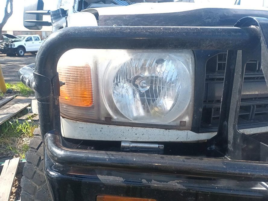 A Close Up of a Car's Headlight and Bumper — South West 4WD Wreckers in Harristown, QLD