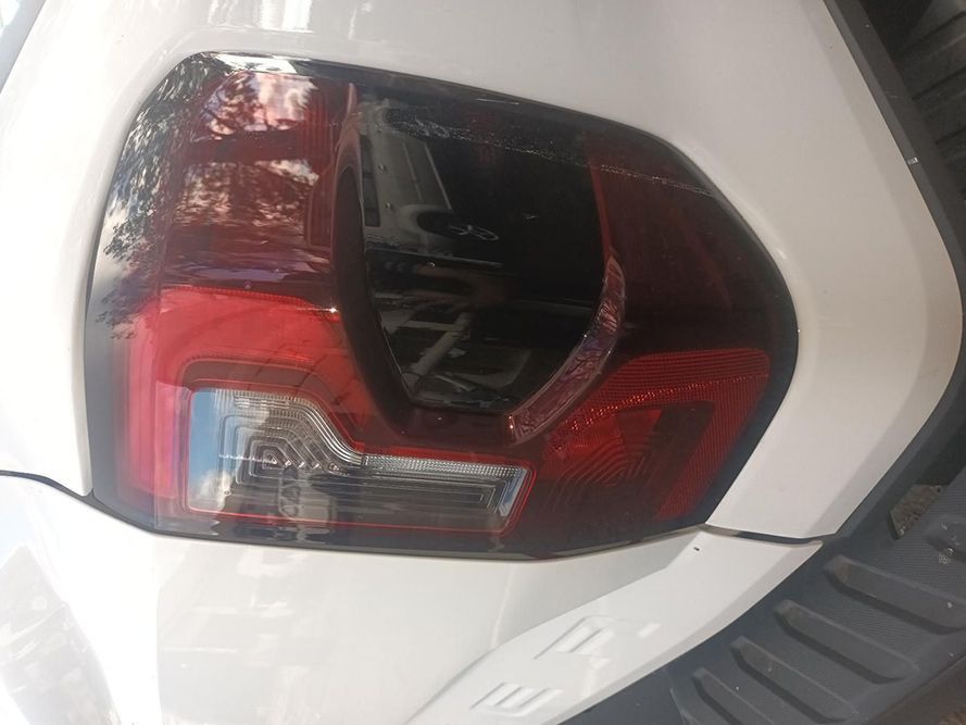 A Close Up of a White Car's Tail Light — South West 4WD Wreckers in Harristown, QLD