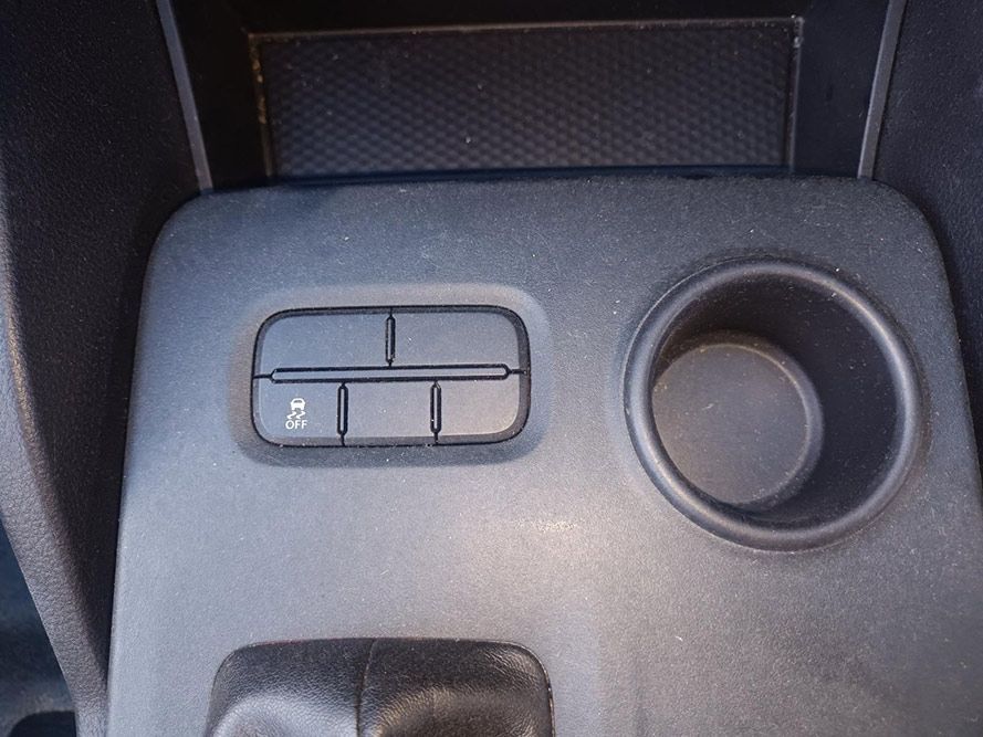 A Close Up of a Car Console with a Cup Holder and a Button — South West 4WD Wreckers in Harristown, QLD