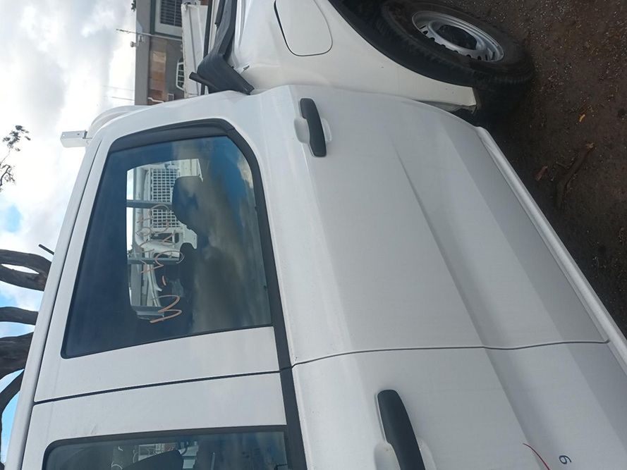 A White Truck is Parked on the Side of the Road — South West 4WD Wreckers in Harristown, QLD