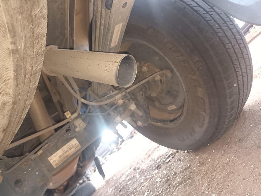 A Close Up of a Tire and Exhaust Pipe on a Car — South West 4WD Wreckers in Harristown, QLD