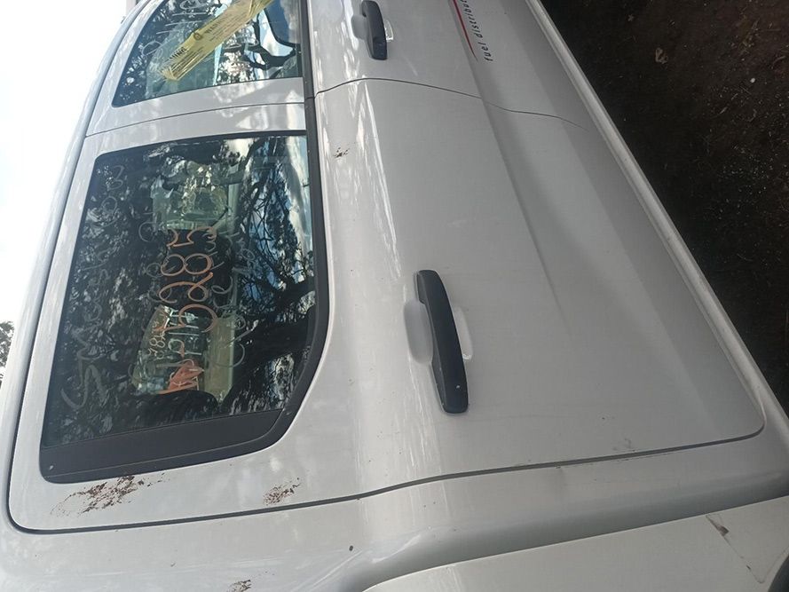 A White Truck is Parked on the Side of the Road — South West 4WD Wreckers in Harristown, QLD