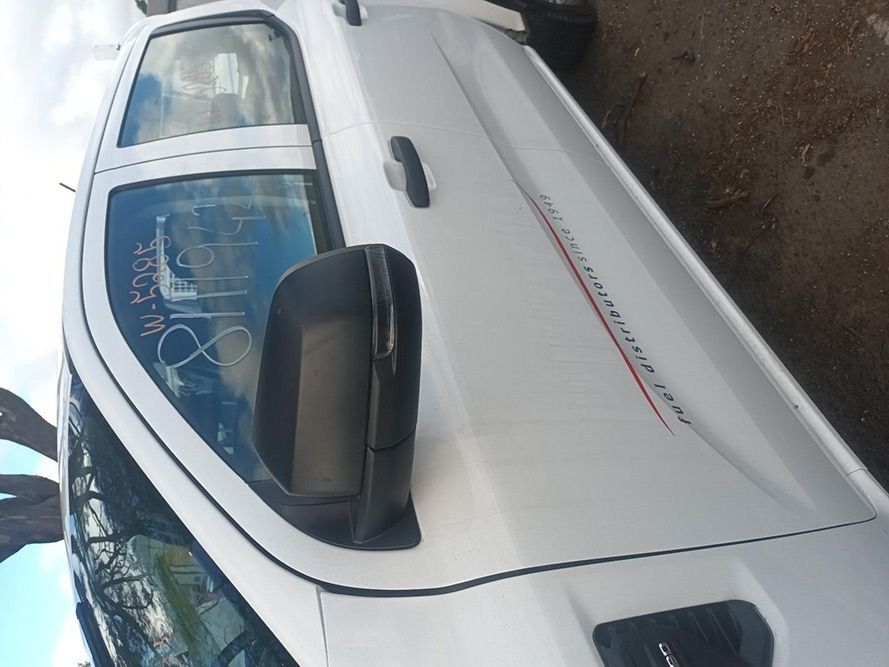 A White Truck is Parked on the Side of the Road — South West 4WD Wreckers in Harristown, QLD 