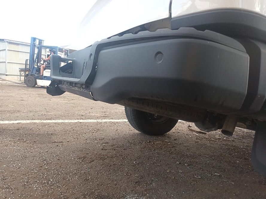 A White Truck with a Black Bumper is Parked in a Parking Lot — South West 4WD Wreckers in Harristown, QLD