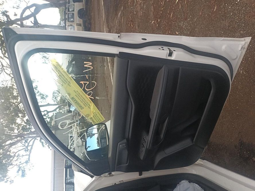 A White Car with the Door Open and a Yellow Tag on the Windshield — South West 4WD Wreckers in Harristown, QLD