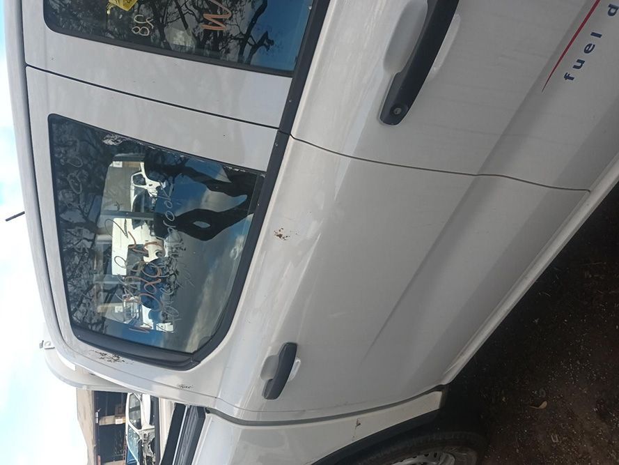 A White Truck is Parked on the Side of the Road — South West 4WD Wreckers in Harristown, QLD