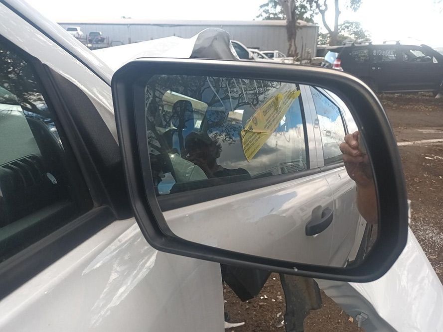 A Close Up of a Side View Mirror on a White Car — South West 4WD Wreckers in Harristown, QLD