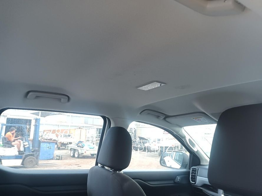 A Car is Parked in a Parking Lot and the Ceiling is Visible — South West 4WD Wreckers in Harristown, QLD
