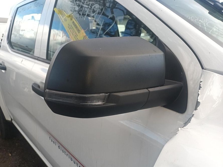 A White Truck with Black Side Mirrors is Parked on the Side of the Road — South West 4WD Wreckers in Harristown, QLD