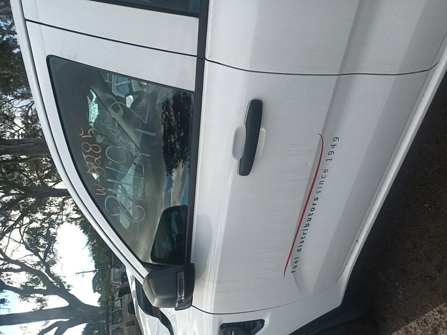 A White Truck is Parked on the Side of the Road — South West 4WD Wreckers in Harristown, QLD