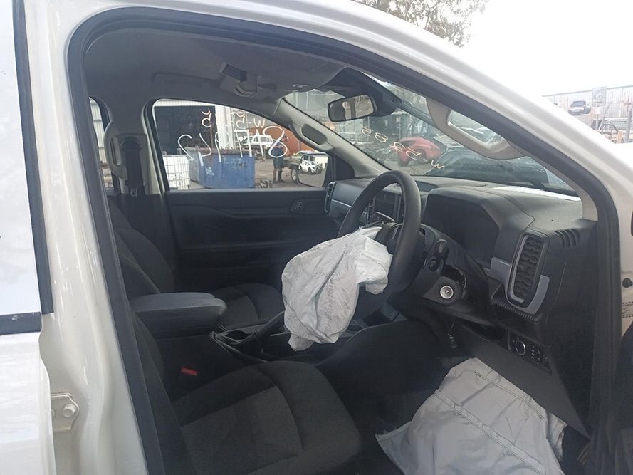 The Inside of a White Car with a Broken Airbag — South West 4WD Wreckers in Harristown, QLD