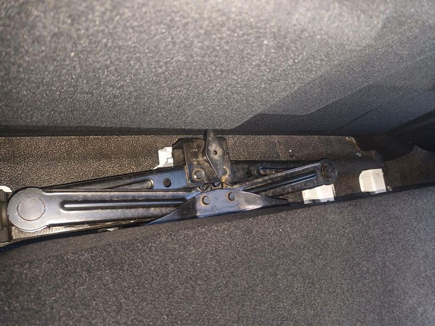 A Jack is Sitting in the Trunk of a Car — South West 4WD Wreckers in Harristown, QLD