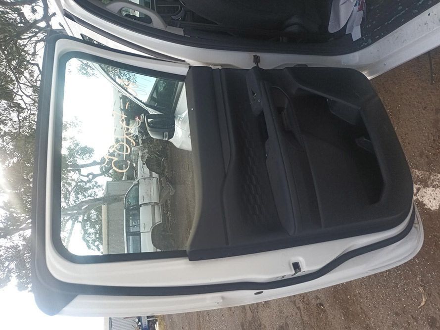 The Back Door of a White Car is Open — South West 4WD Wreckers in Harristown, QLD