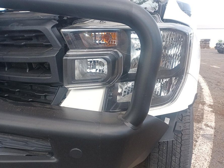 A White Truck with a Black Bumper is Parked in a Parking Lot — South West 4WD Wreckers in Harristown, QLD