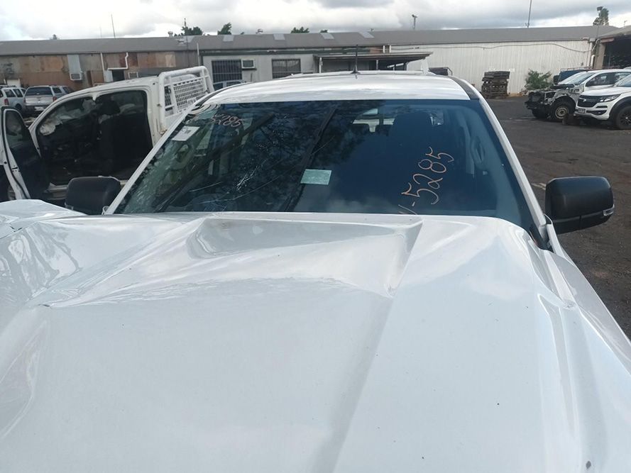 A White Truck with a Broken Windshield is Parked in a Parking Lot — South West 4WD Wreckers in Harristown, QLD