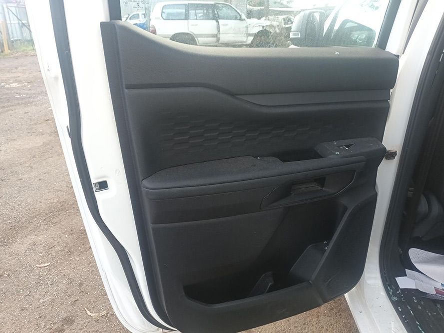 The Inside of a White Car with the Door Open — South West 4WD Wreckers in Harristown, QLD