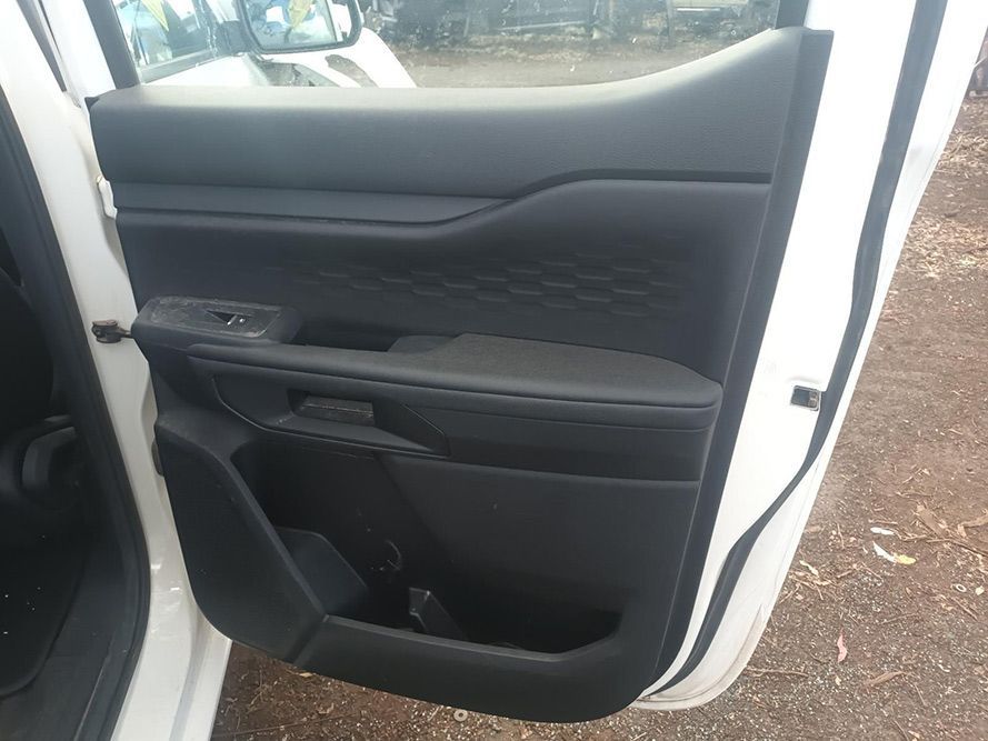 A White Car with the Door Open is Parked on a Dirt Road — South West 4WD Wreckers in Harristown, QLD