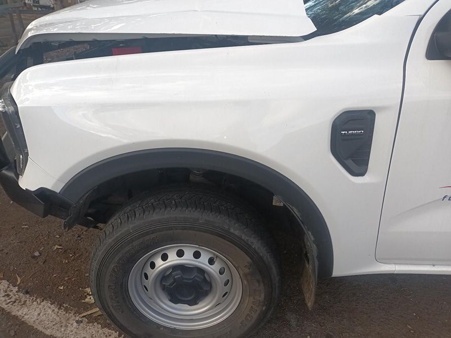A White Truck with the Hood Up is Parked on the Side of the Road — South West 4WD Wreckers in Harristown, QLD