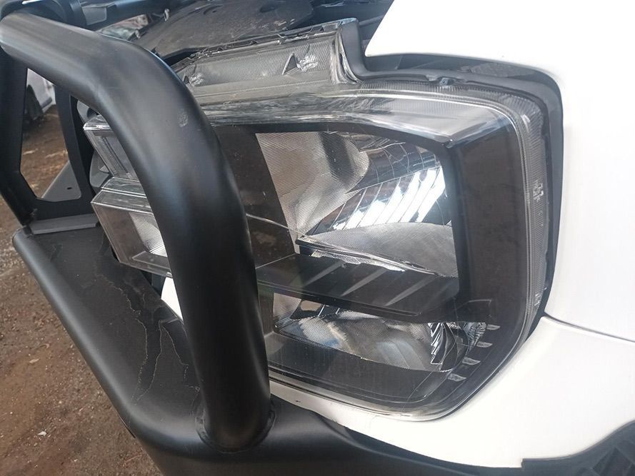 A Close Up of a Car's Headlight with a Black Bumper — South West 4WD Wreckers in Harristown, QLD