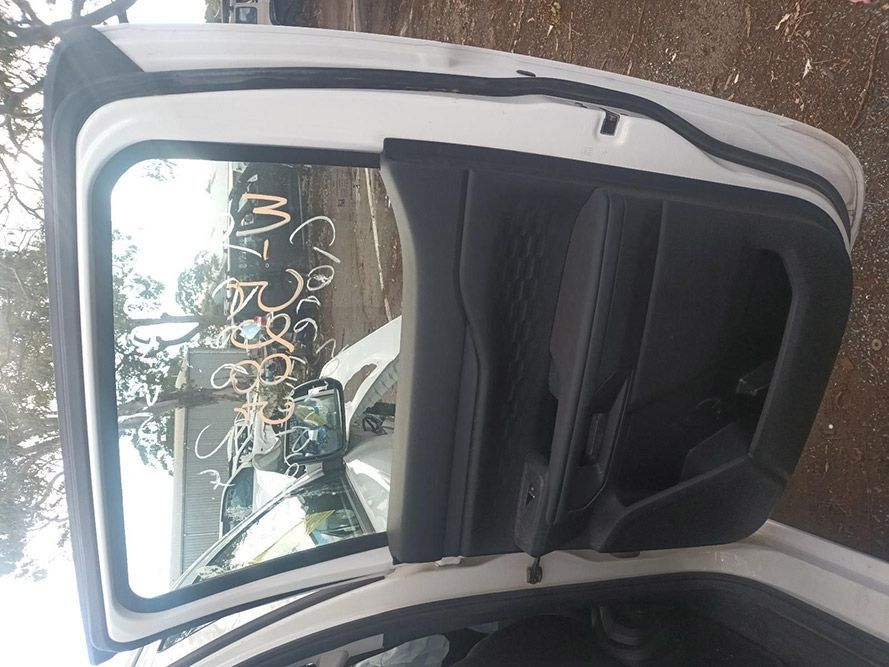 The Back Door of a White Car with the Door Open — South West 4WD Wreckers in Harristown, QLD